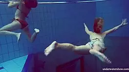 Marusia and melisa darkova bathe in bikini underwater.