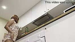 Petite 18+ Latina wife flashes big ass in kitchen. No panties or bra in summer dress.