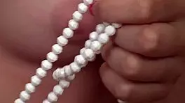 cute yankee blonde evalina enjoys solo fun with pearls, masturbating her clit to orgasm.