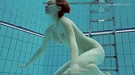 Lada Poleshuk bathes hot in pool, wet and underwater.