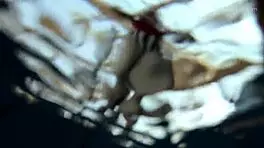 Lada Poleshuk bathes hot in pool, wet and underwater.