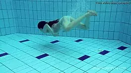 Roxalana swims in pool exposing tight pussy