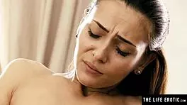 Cute brunette strips lingerie to finger herself hard.