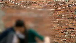 She sucks her classmate's cock behind the school classrooms in this public Mexican sex video.