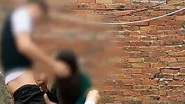 She sucks her classmate's cock behind the school classrooms in this public Mexican sex video.