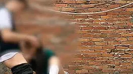 She sucks her classmate's cock behind the school classrooms in this public Mexican sex video.