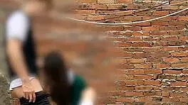 She sucks her classmate's cock behind the school classrooms in this public Mexican sex video.