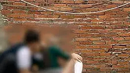 She sucks her classmate's cock behind the school classrooms in this public Mexican sex video.