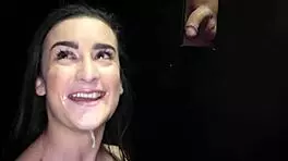 Young girl sucking cocks through gloryhole and swallowing