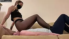 Tattooed mistress Sofi dominates with nylon pantyhose facesitting