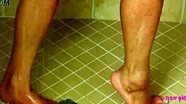 Tiny brunette enjoys a relaxing hot shower