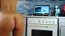 watch sexydeas tease her big ass and shaved pussy in a sizzling kitchen webcam show