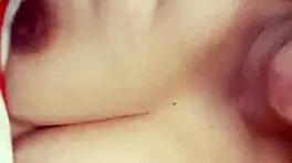 Teen masturbates to Christmas music, reaching orgasm.