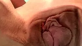 Look at this petite teen rubbing her pussy on the glass table.