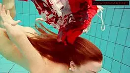 Hairy ginger Polish teen 18+ swims naked in pool underwater, showing tits in bikini