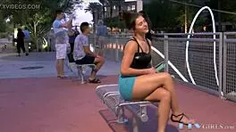 the redhead teen babe toys her pussy outdoors in public with a vibrator.