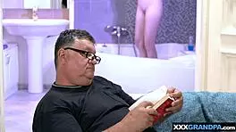 big boobed blondie suggestively cares for dirty old man's cock