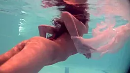 Russian Babe Natalia Swims And Strips