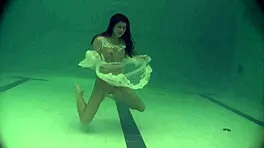 Russian Babe Natalia Swims And Strips