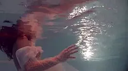 Russian Babe Natalia Swims And Strips