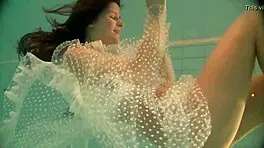 Russian Babe Natalia Swims And Strips