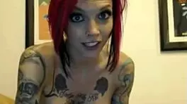 tattooed cam girl dildoing her pussy and ass