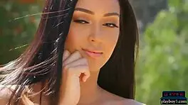 Gorgeous model stripteases outdoors with ripped clothes