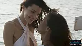 Petite asian and russian model on boat trip with ripped clothes.