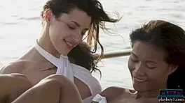 Petite asian and russian model on boat trip with ripped clothes.