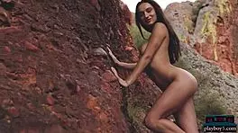 Gloria Sol performs an outdoor striptease in the mountains.