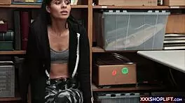 A mall security officer dressed as Santa clause deals with a young store cretin