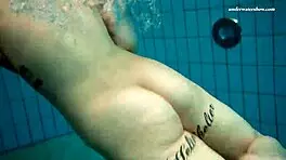 Dashka enjoys a beautiful swim in the pool, going from bikini to naked underwater.