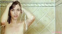 Captivating Brunette Enjoys Sensual Shower with Steamy Lesbian Vibes