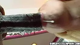 Feeling excited, the cute blonde teen passionately sucks the big black monster cock.