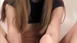 A passionate bouncing teen gives passionate footjob and dildo eating