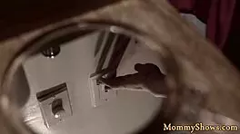 Does the stepmom strap on to fuck the teen in this lesbian threesome?