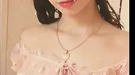 Kawaii woman shows her natural tits in the bedroom