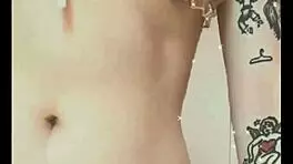 Kawaii woman shows her natural tits in the bedroom