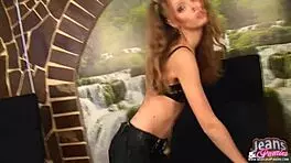 Slim teen undresses sexy body in tight jeans for striptease.