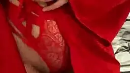 brunette in red lingerie plays with herself