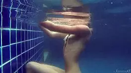 Blonde pool babe Wendy swims nude underwater!