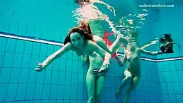 Avenna, Nina Mohnatka, and Marketa dive into steamy pool fun with bikini babes