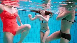 Avenna, Nina Mohnatka, and Marketa dive into steamy pool fun with bikini babes