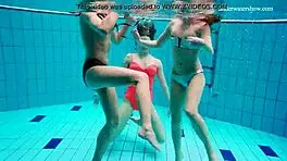 Avenna, Nina Mohnatka, and Marketa dive into steamy pool fun with bikini babes