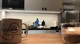 Young amateur wife does dishes while voyeur cam captures her in tight leggings and thong