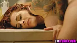 Busty German lesbians lick each other's pussies.