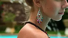 sexy blue-eyed blonde teen 18+ strips naked by the pool for full erotic video