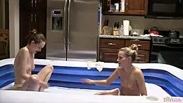 Party lesbians kiss and scissor with oiled trimmed pussies