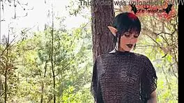 Gothic Elf Teen 18+ Plays with Toys in Forest Setting