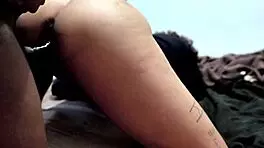 She struggles to talk while getting pounded doggystyle. Backstage, her pierced nipples shine as she screams.